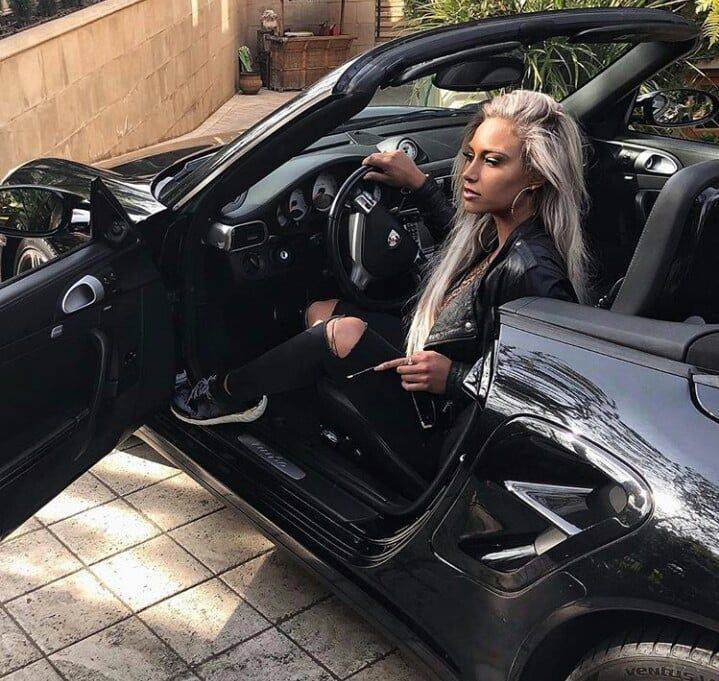 blonde girl in luxury car